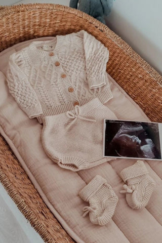 Baby Changing Basket with Knitted Beige outfit and pregnancy scan