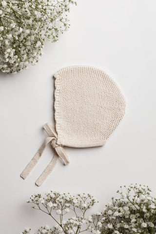 Beige knitted baby bonnet