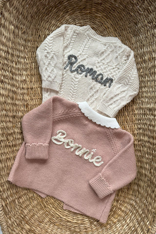 Embroidered knitted baby cardigans in moses basket 'Roman' and 'Bonnie'